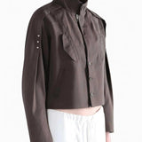 Brown jacket worn by a person, side view