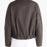 Brown jacket worn by a person, back view