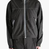 Brown jacket worn by a person, showing the jacket fit