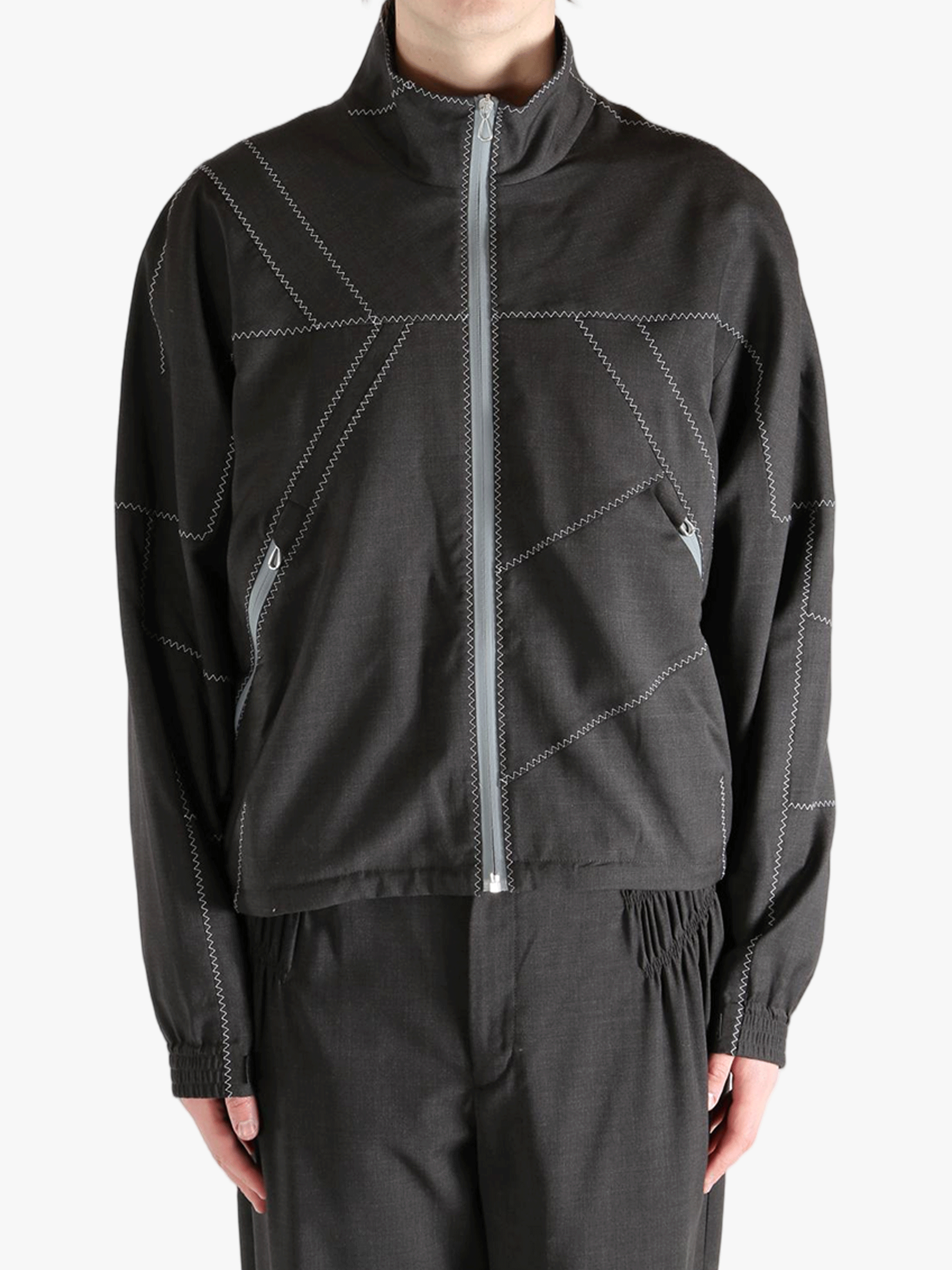 Brown jacket worn by a person, showing the jacket fit