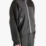 Brown jacket worn by a person, showing the jacket fit