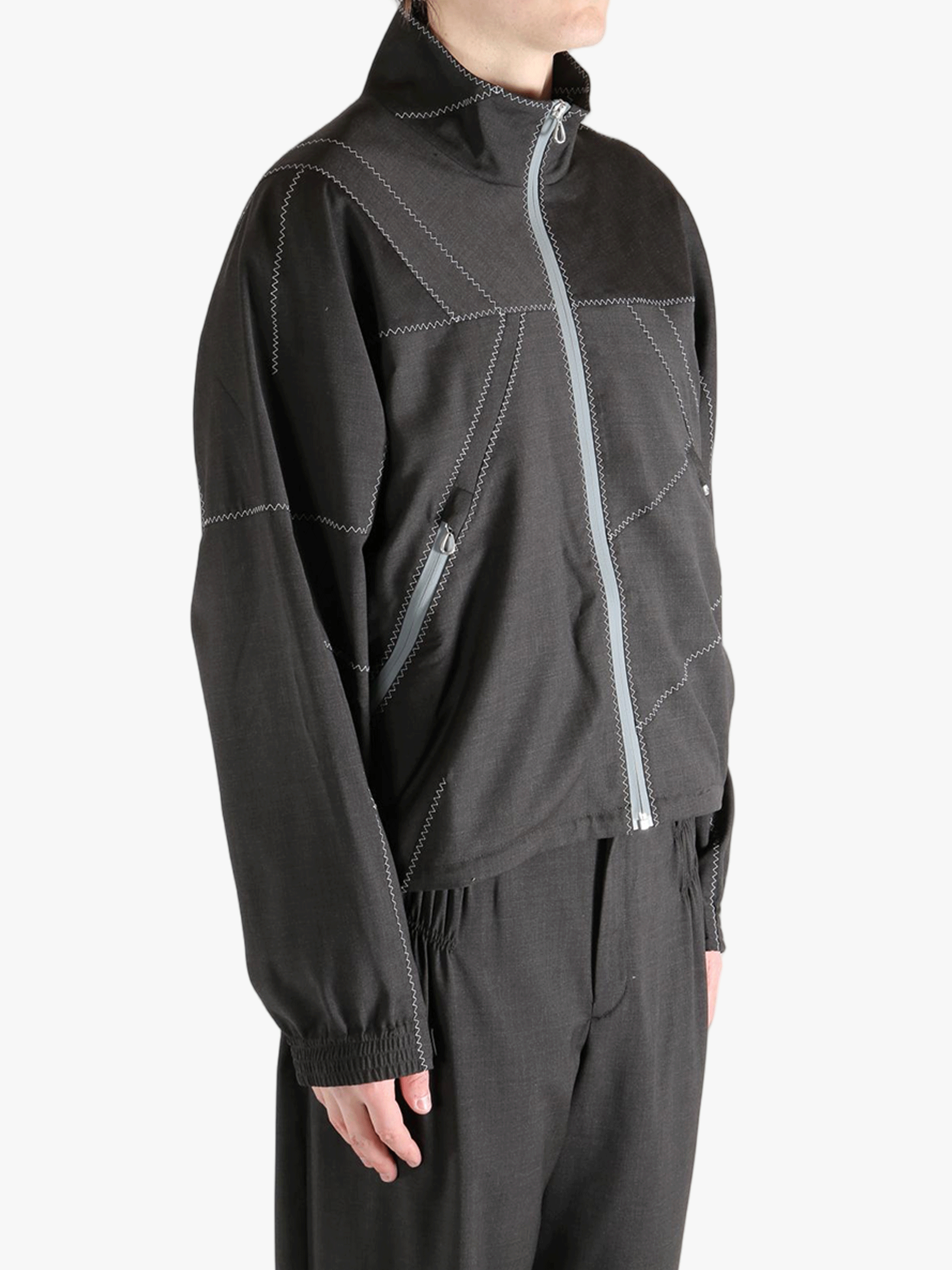 Brown jacket worn by a person, showing the jacket fit