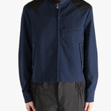 Navy jacket worn by a person, showing the jacket fit