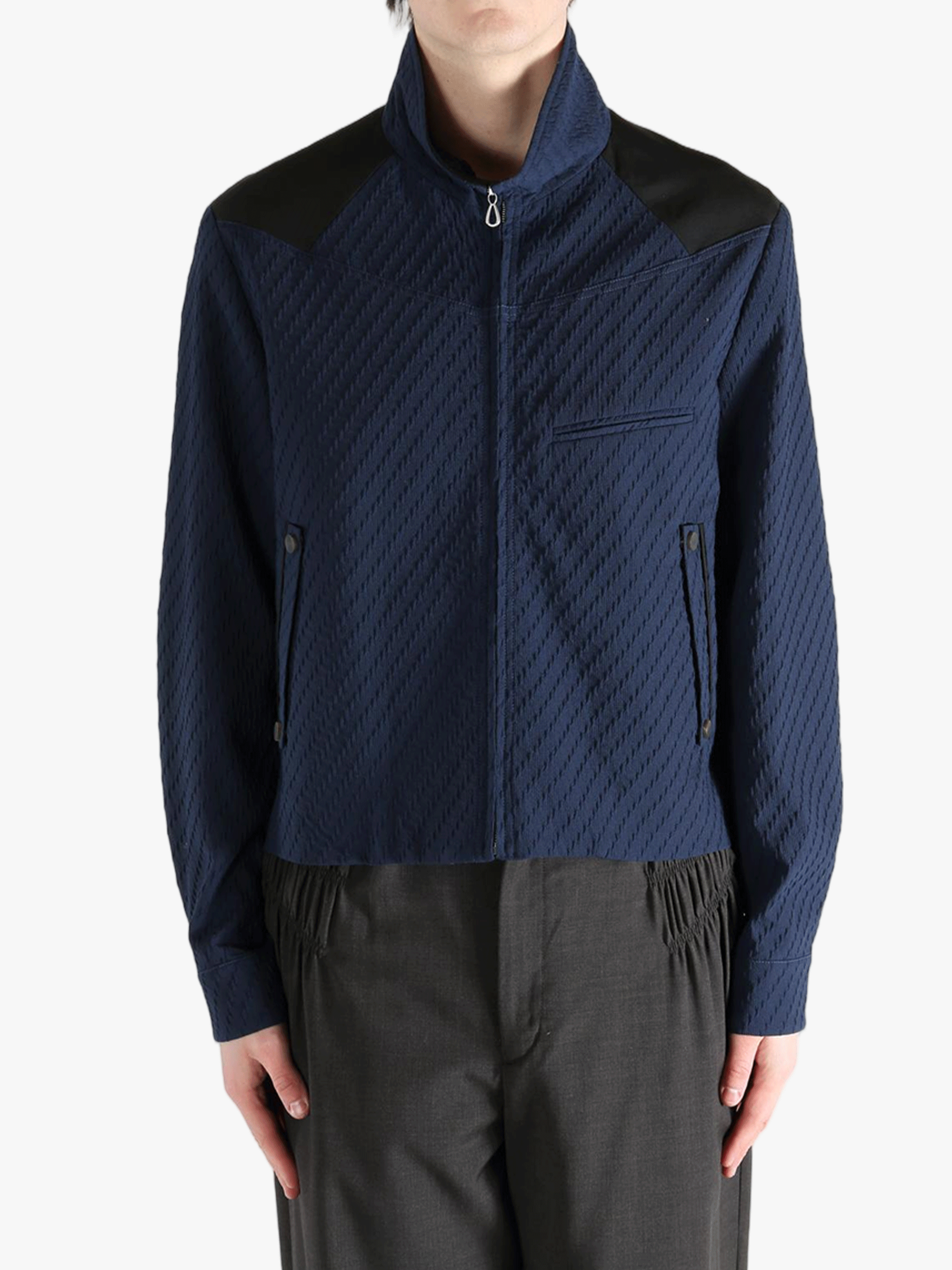 Navy jacket worn by a person, showing the jacket fit