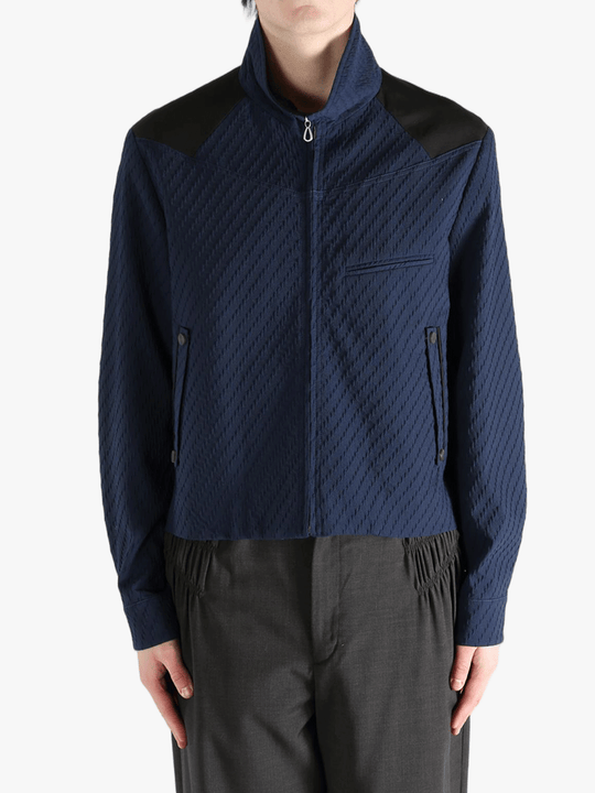 Navy jacket worn by a person, showing the jacket fit