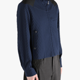 Navy jacket worn by a person, showing the jacket fit