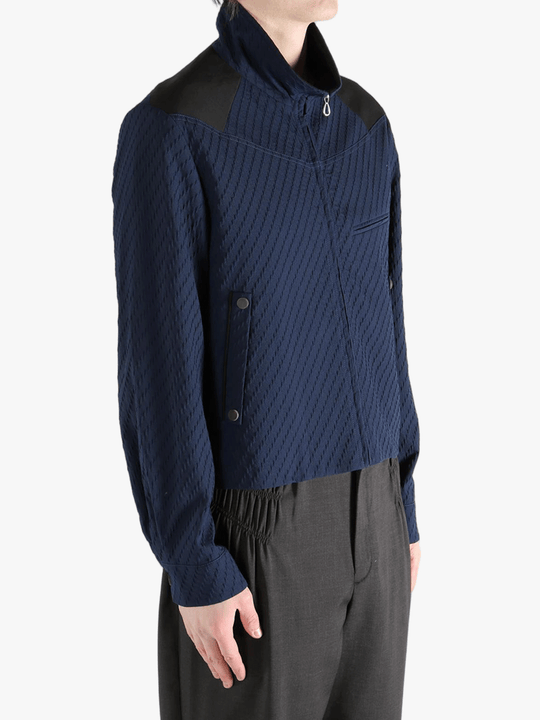 Navy jacket worn by a person, showing the jacket fit