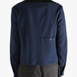 Navy jacket worn by a person, showing the jacket fit