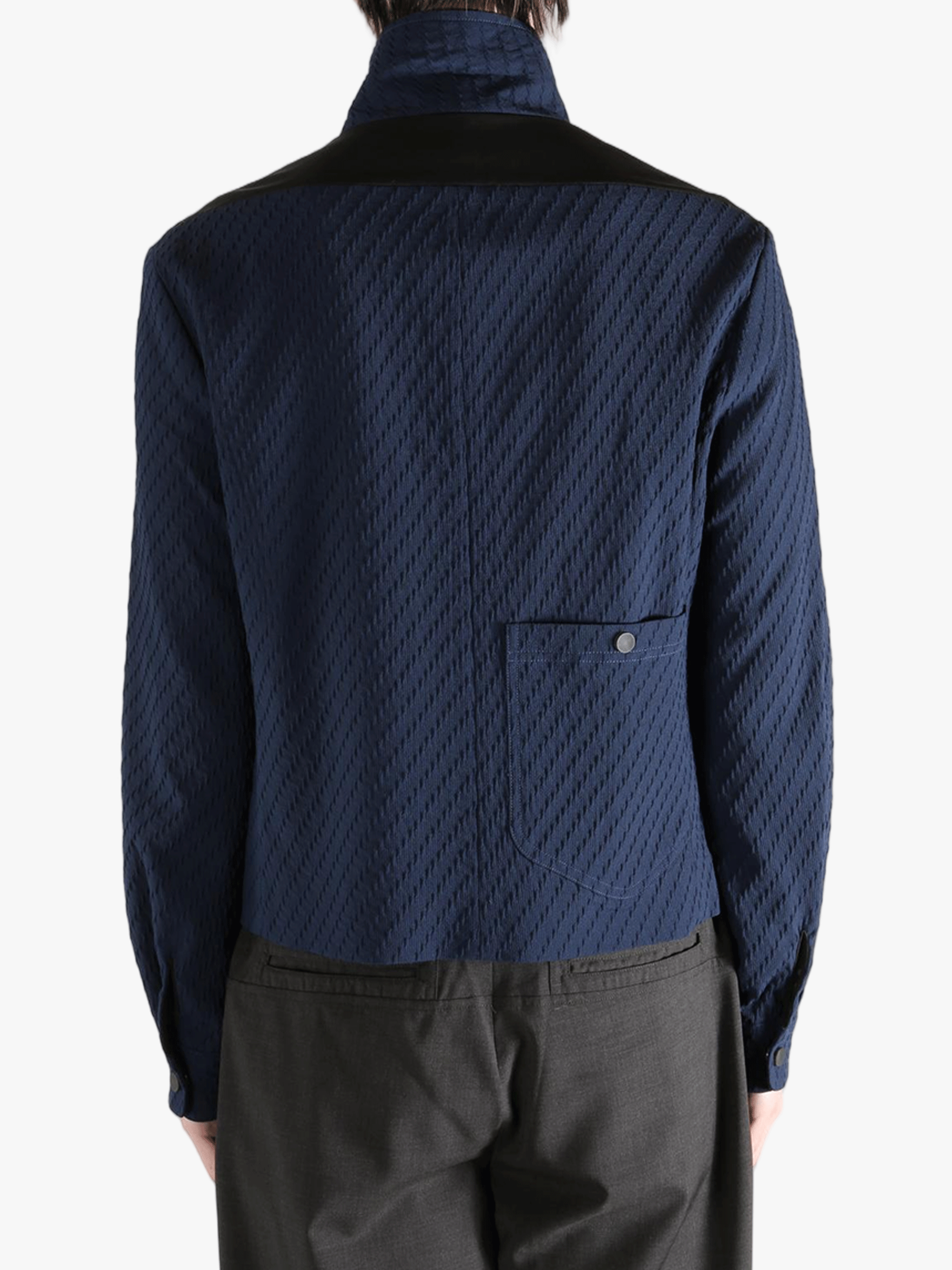 Navy jacket worn by a person, showing the jacket fit