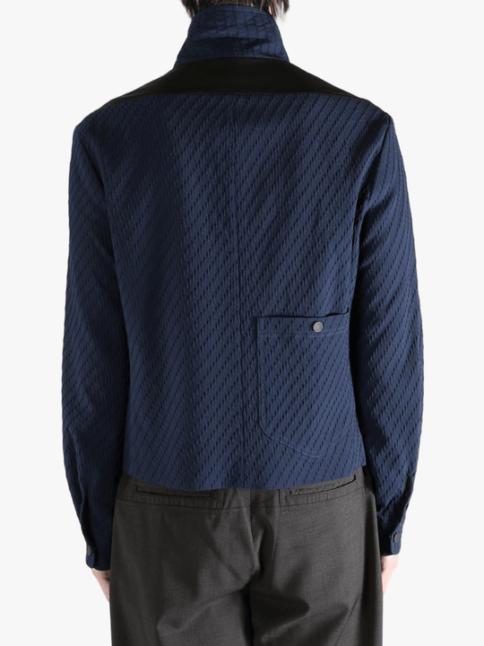 Navy jacket worn by a person, showing the jacket fit