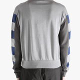 Navy knitwear worn by a person, showing the knitwear fit