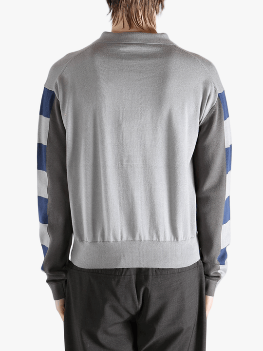 Navy knitwear worn by a person, showing the knitwear fit