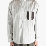 White shirt worn by a person, showing the shirt's fit