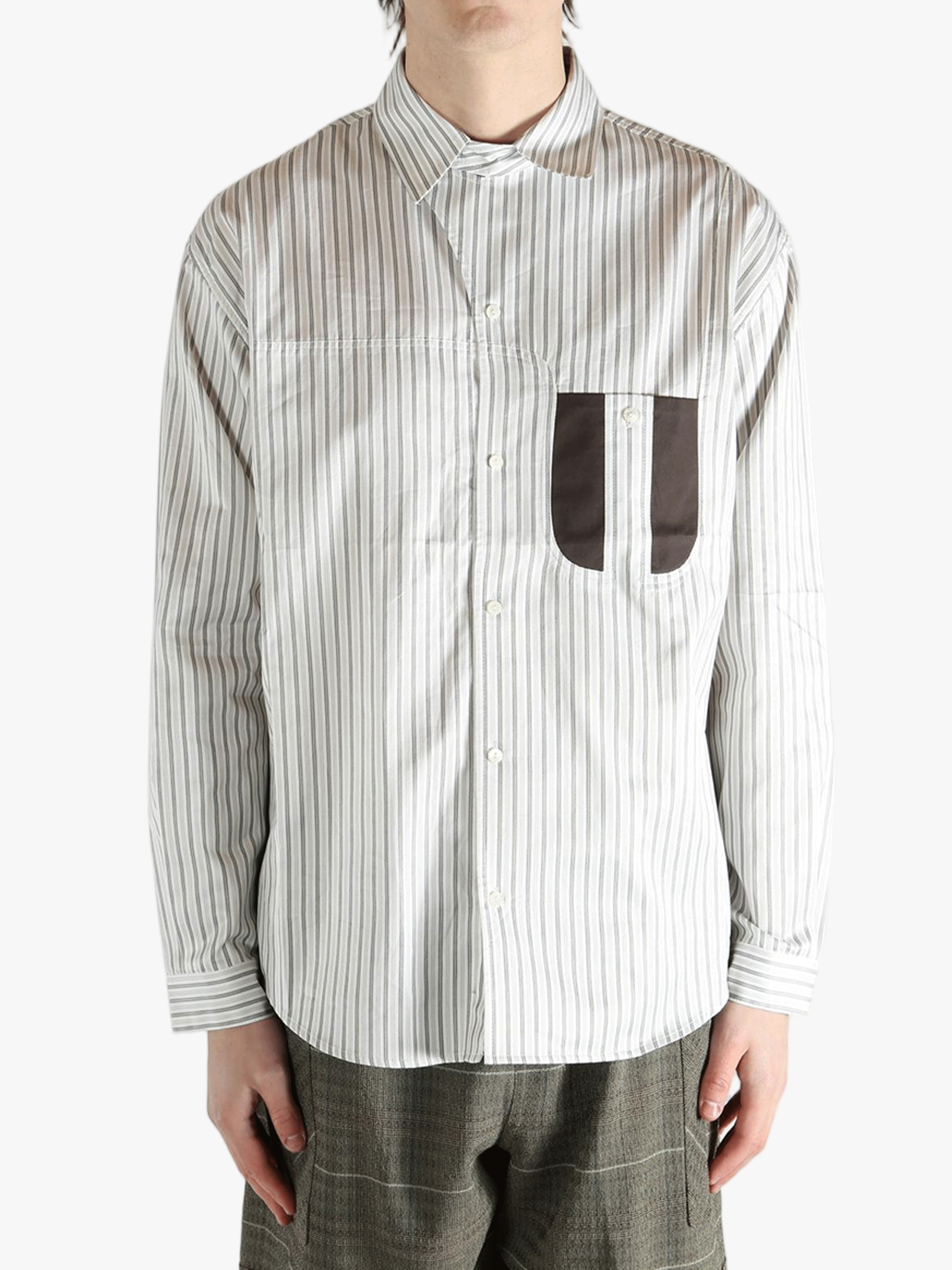 White shirt worn by a person, showing the shirt's fit