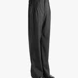 Grey pant worn by a person, showing the pant fit