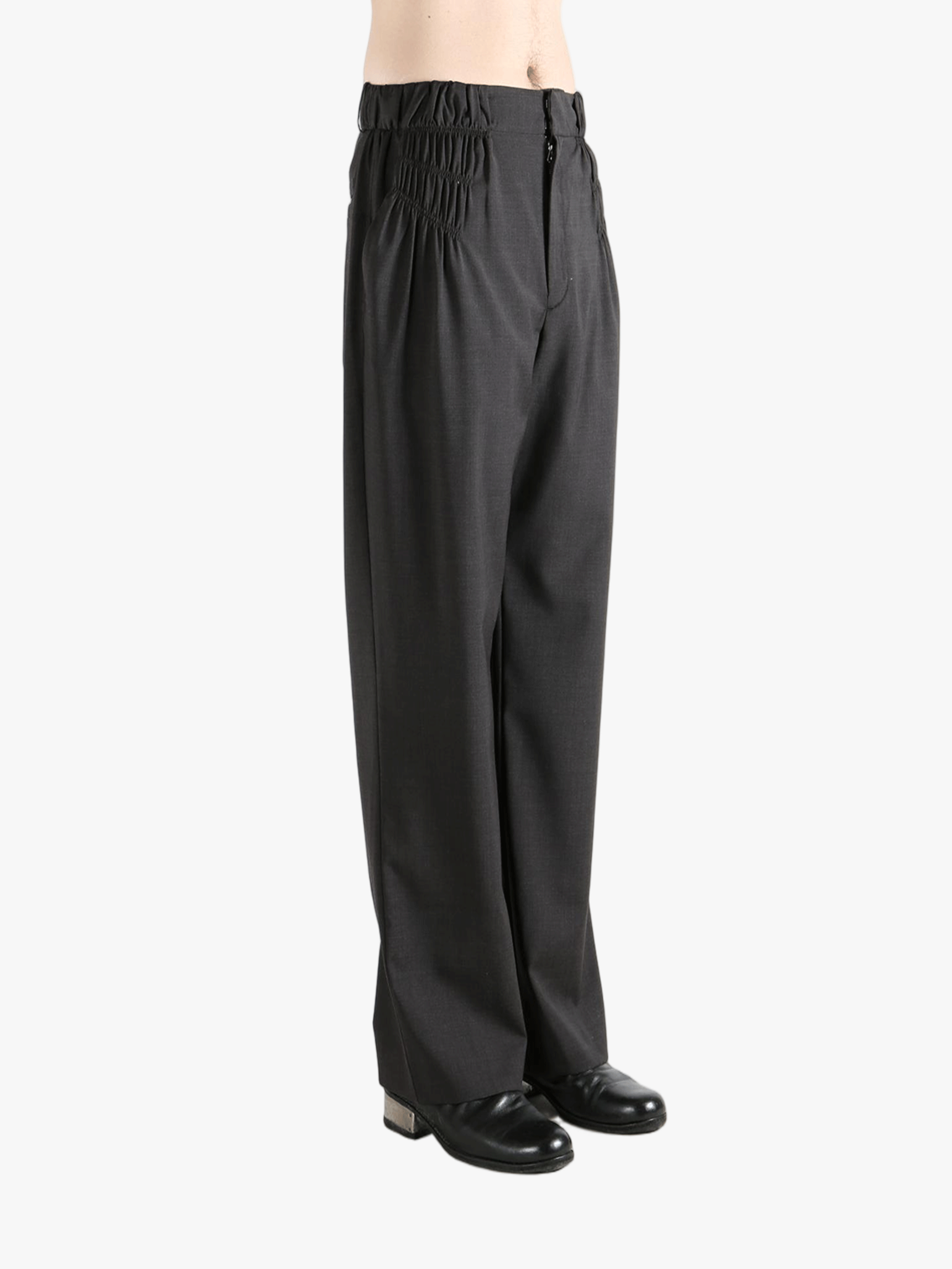 Grey pant worn by a person, showing the pant fit