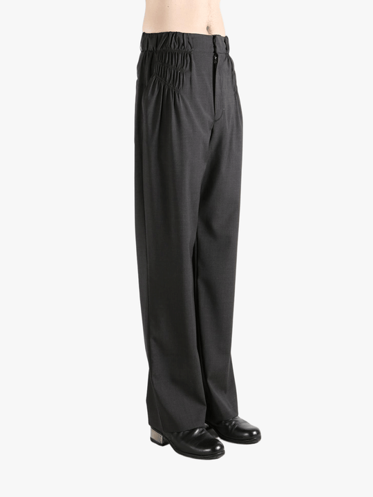 Grey pant worn by a person, showing the pant fit