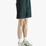 Green short worn by a person, showing the short fit