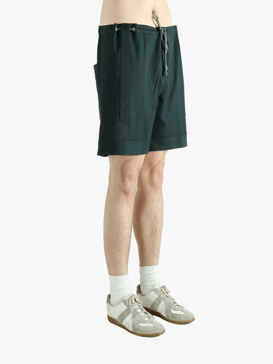 Green short worn by a person, showing the short fit