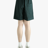 Green short worn by a person, showing the short fit