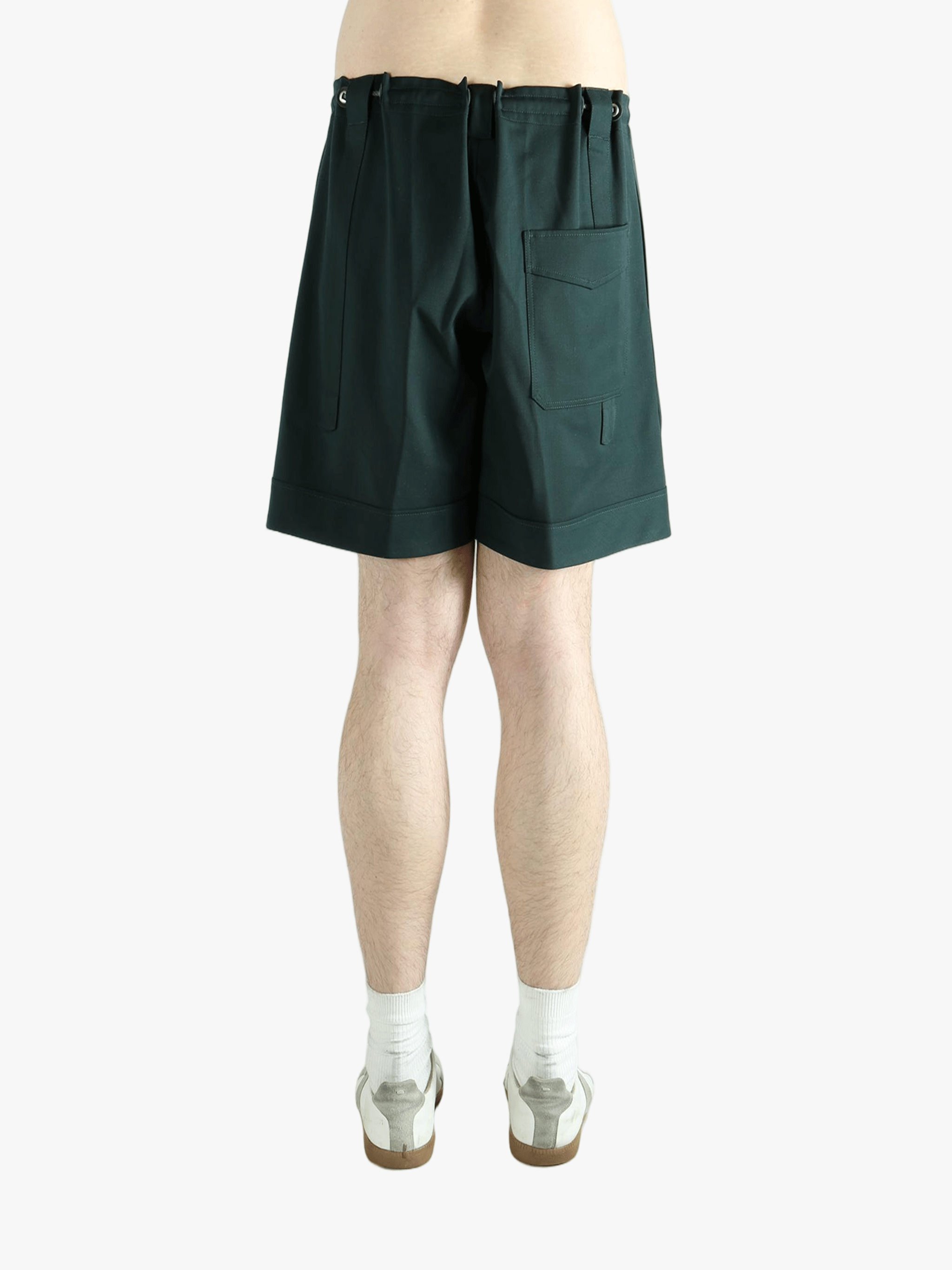 Green short worn by a person, showing the short fit