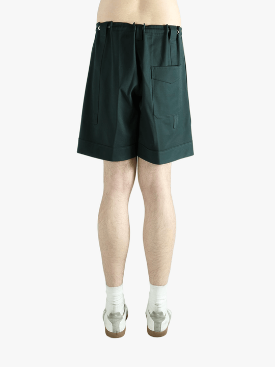 Green short worn by a person, showing the short fit
