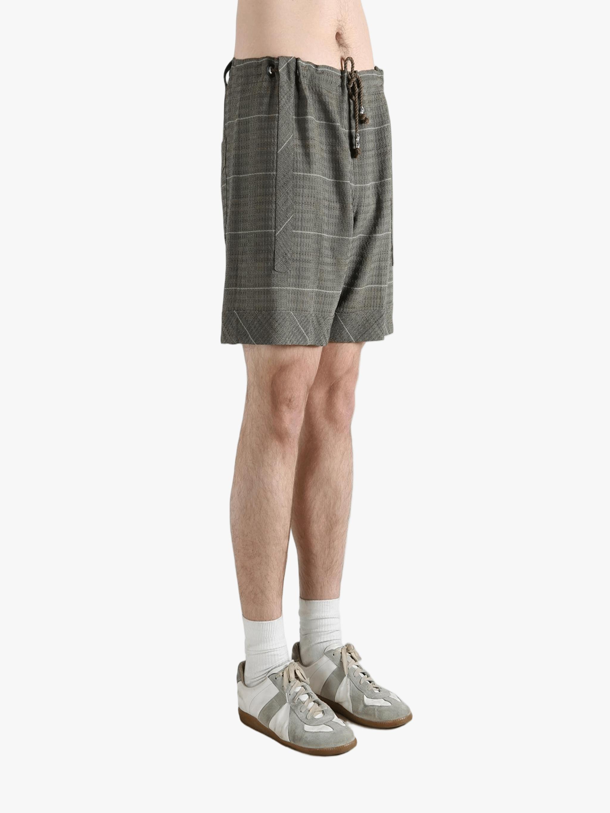 Grey short worn by a person, showing the short fit