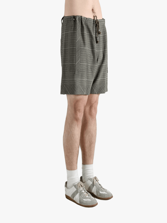 Grey short worn by a person, showing the short fit