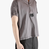 Grey shirt worn by a person, showing the shirt's fit