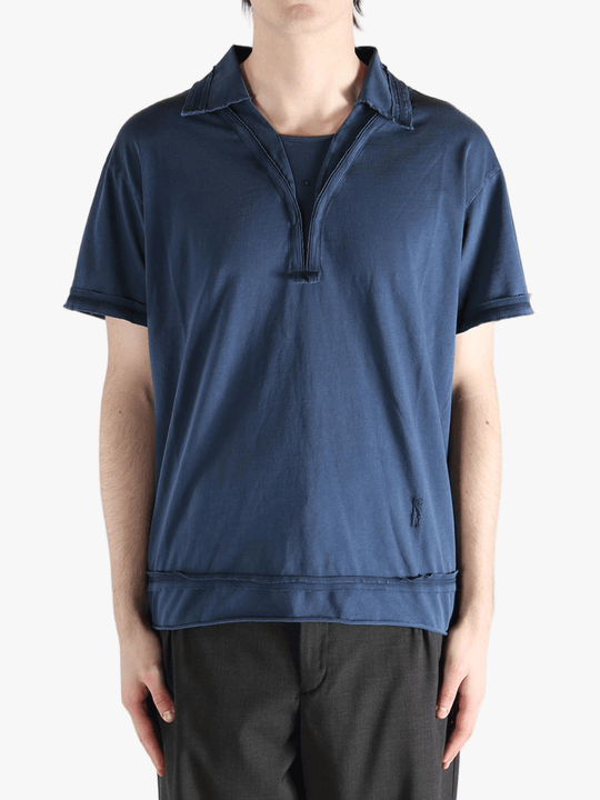 Blue polo shirt worn by a person, showing the shirt's fit