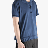 Blue polo shirt worn by a person, showing the shirt's fit