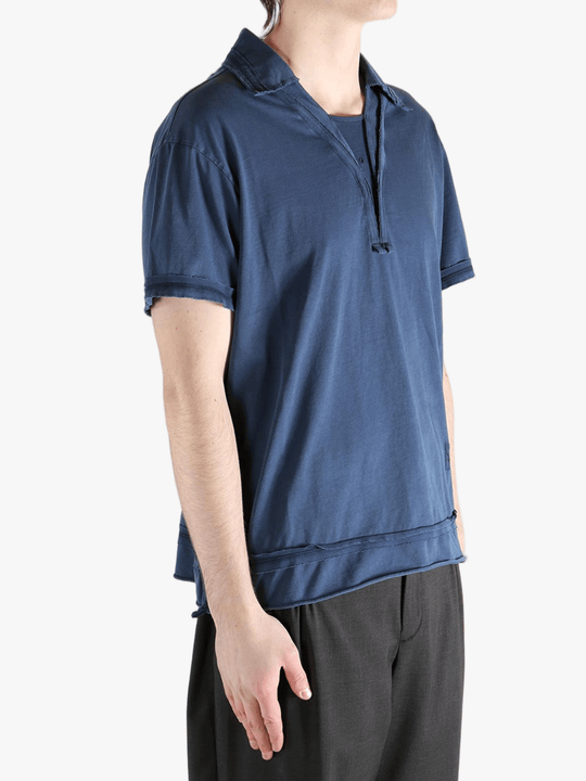 Blue polo shirt worn by a person, showing the shirt's fit