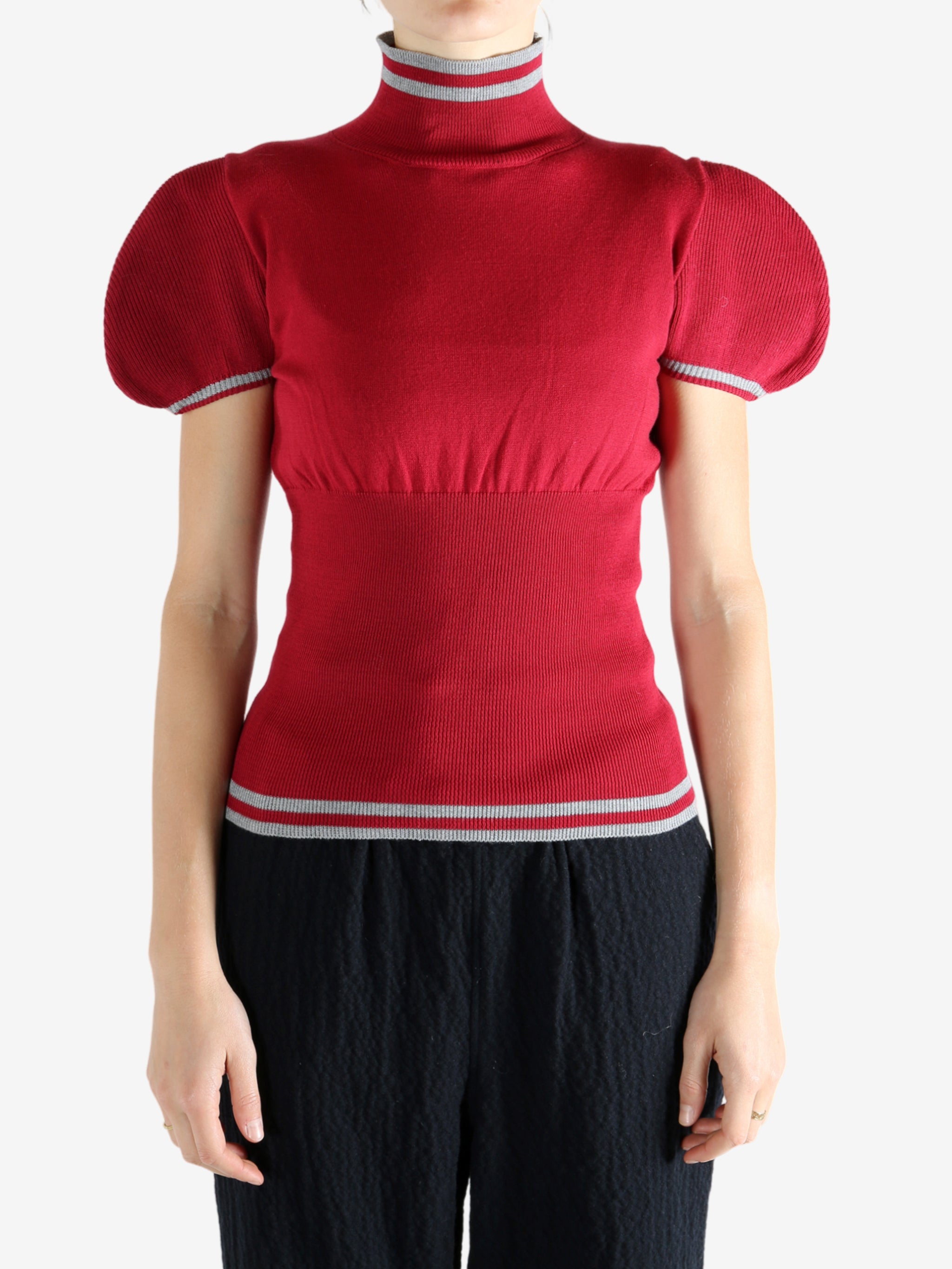 Red top worn by a person, showing the top's fit