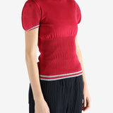 Red top worn by a person, showing the top's fit