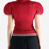 Red top worn by a person, showing the top's fit