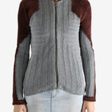 Grey shirt worn by a person, showing the shirt's fit