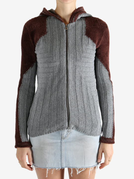 Grey shirt worn by a person, showing the shirt's fit