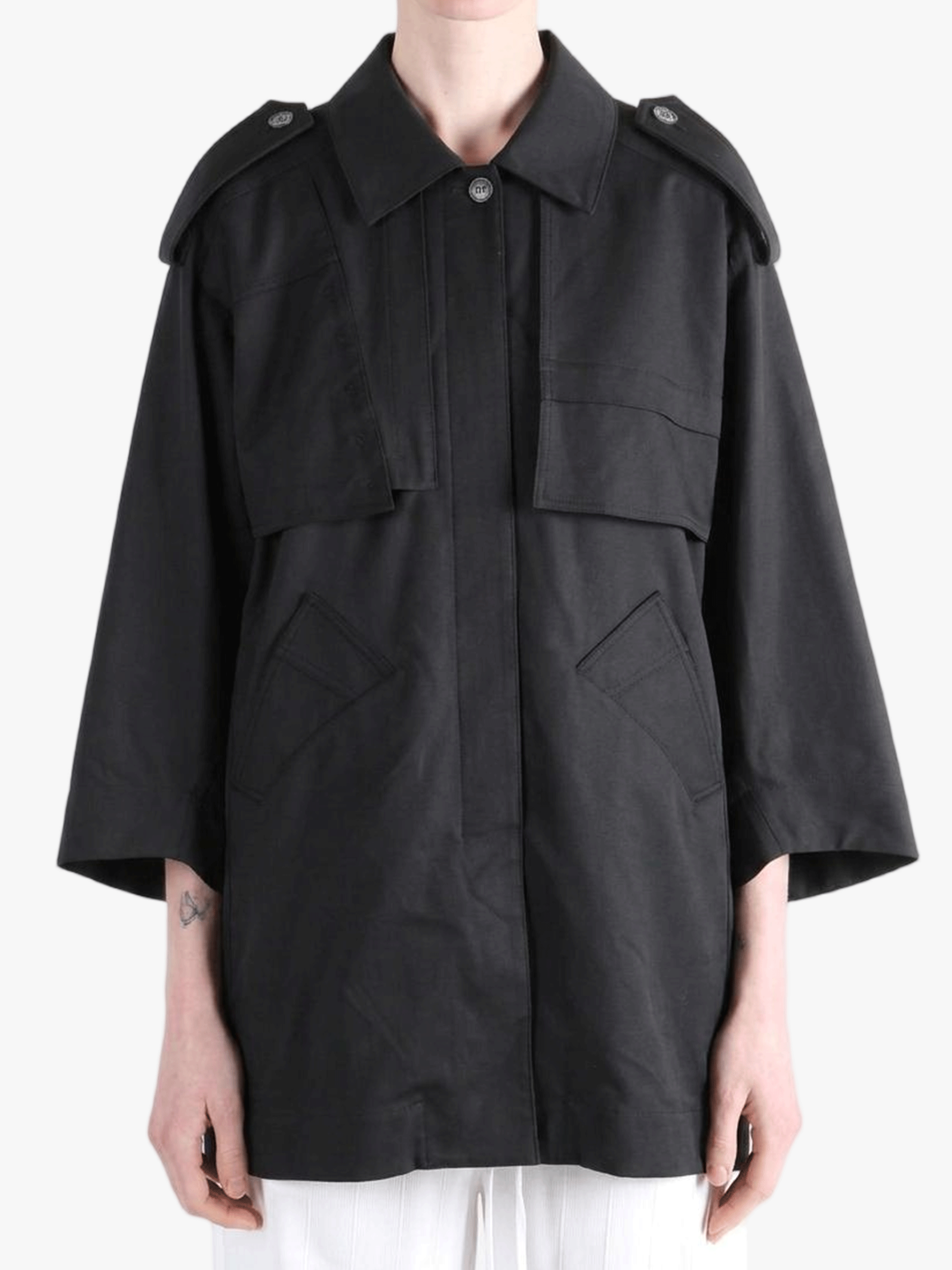 Black jacket worn by a person, showing the jacket fit