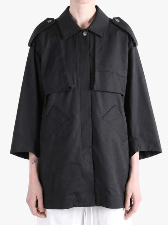 Black jacket worn by a person, showing the jacket fit