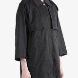 Black jacket worn by a person, side view