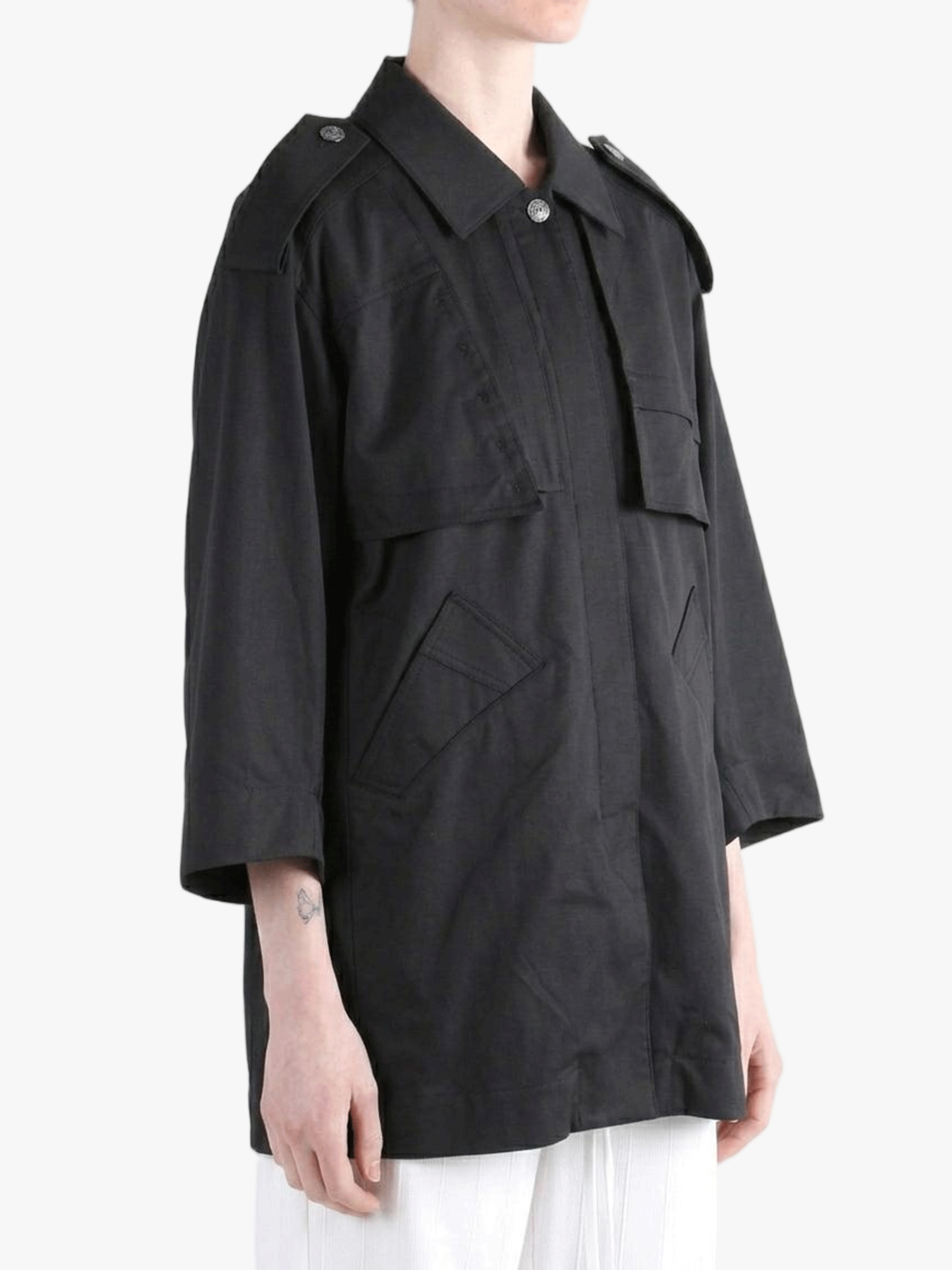 Black jacket worn by a person, side view