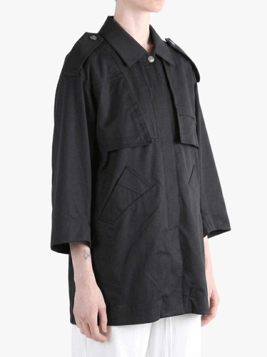 Black jacket worn by a person, side view