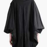 Black jacket worn by a person, back view