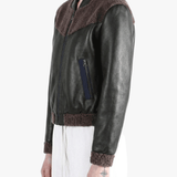Black jacket worn by a person, side view