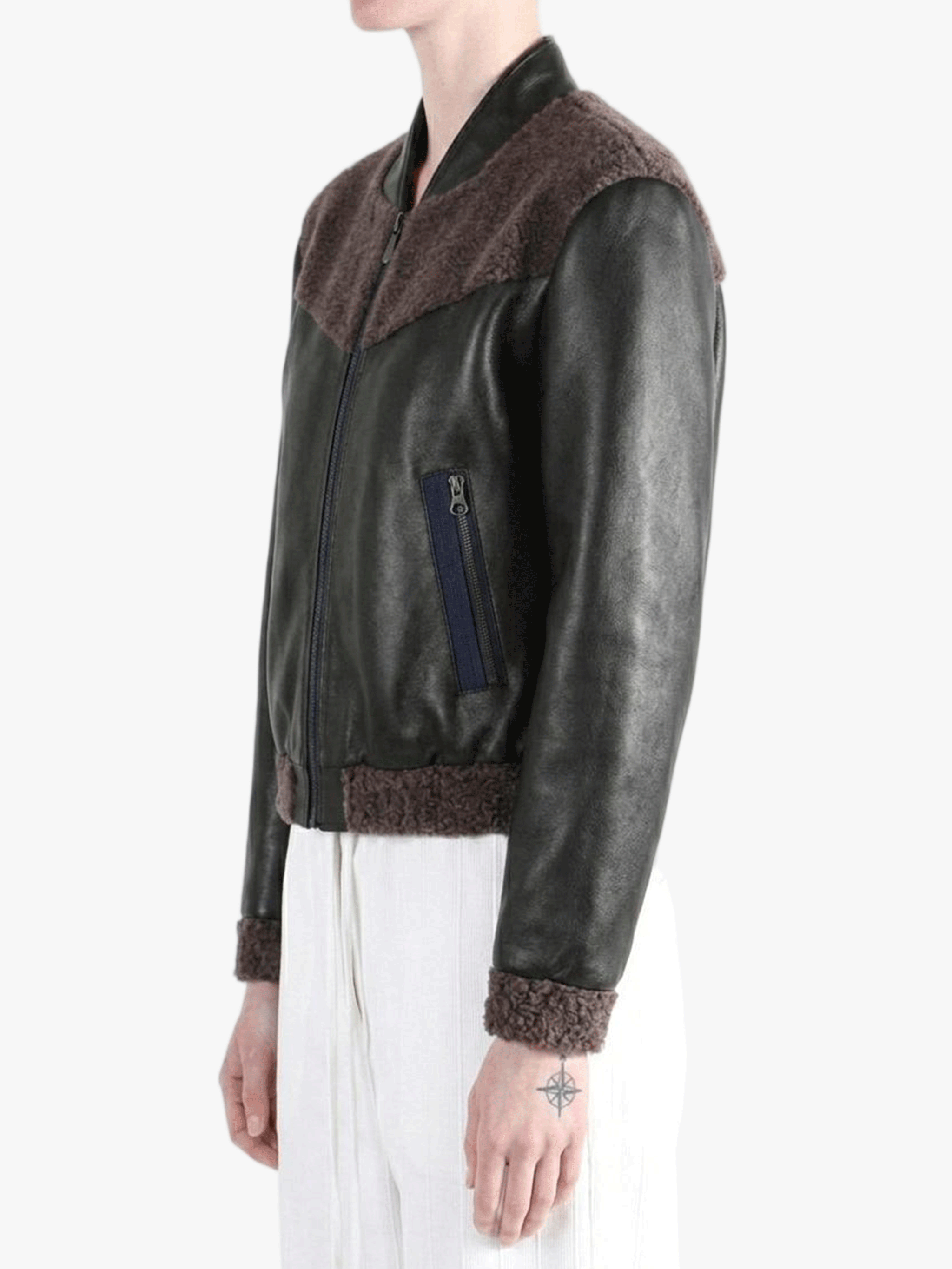 Black jacket worn by a person, side view