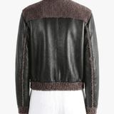 Black jacket worn by a person, back view