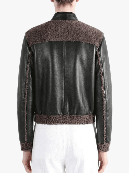 Black jacket worn by a person, back view