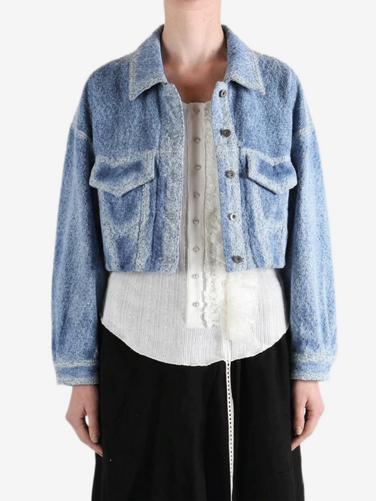 Blue jacket worn by a person,showing the jacket fit