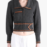 Black jacket worn by a person, showing the jacket fit