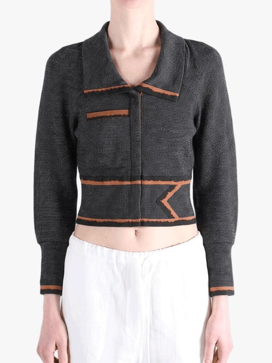 Black jacket worn by a person, showing the jacket fit